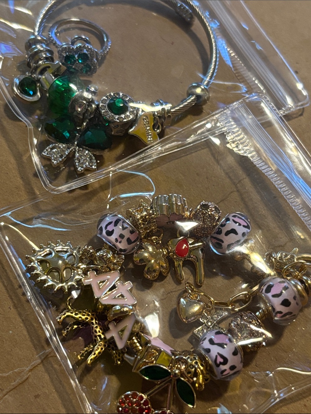 Gold-Tone Charm Bracelet with Pink Leopard Beads and Green Accents